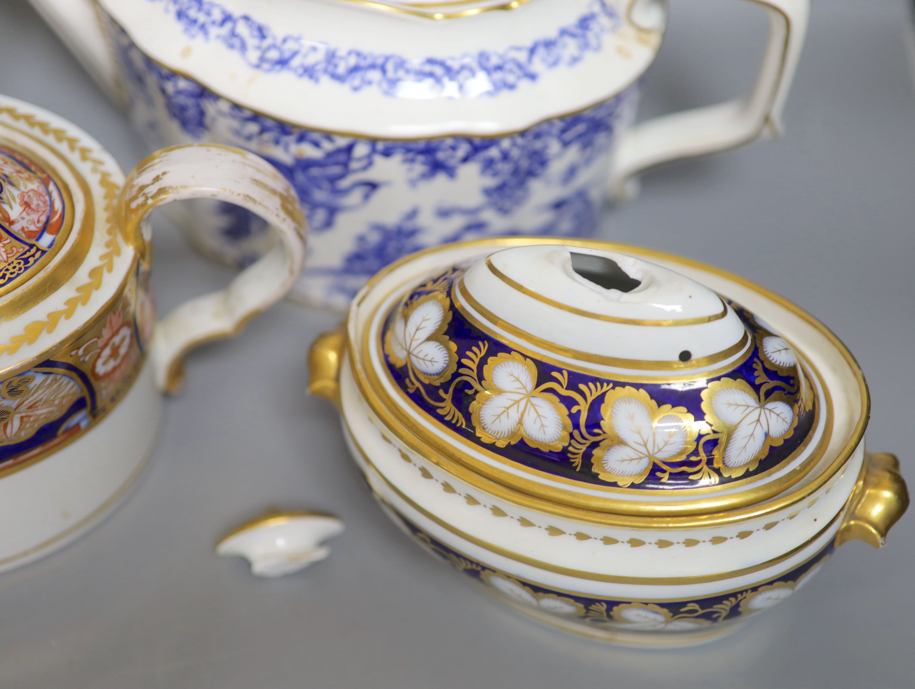 Three various porcelain teapots, a cream jug and a sucrier